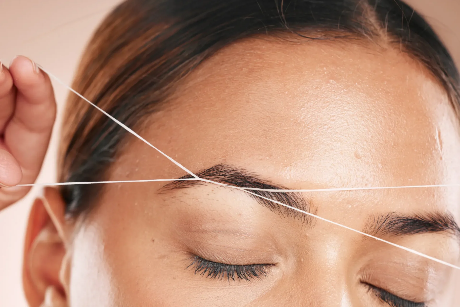 Eyebrow threading close-up