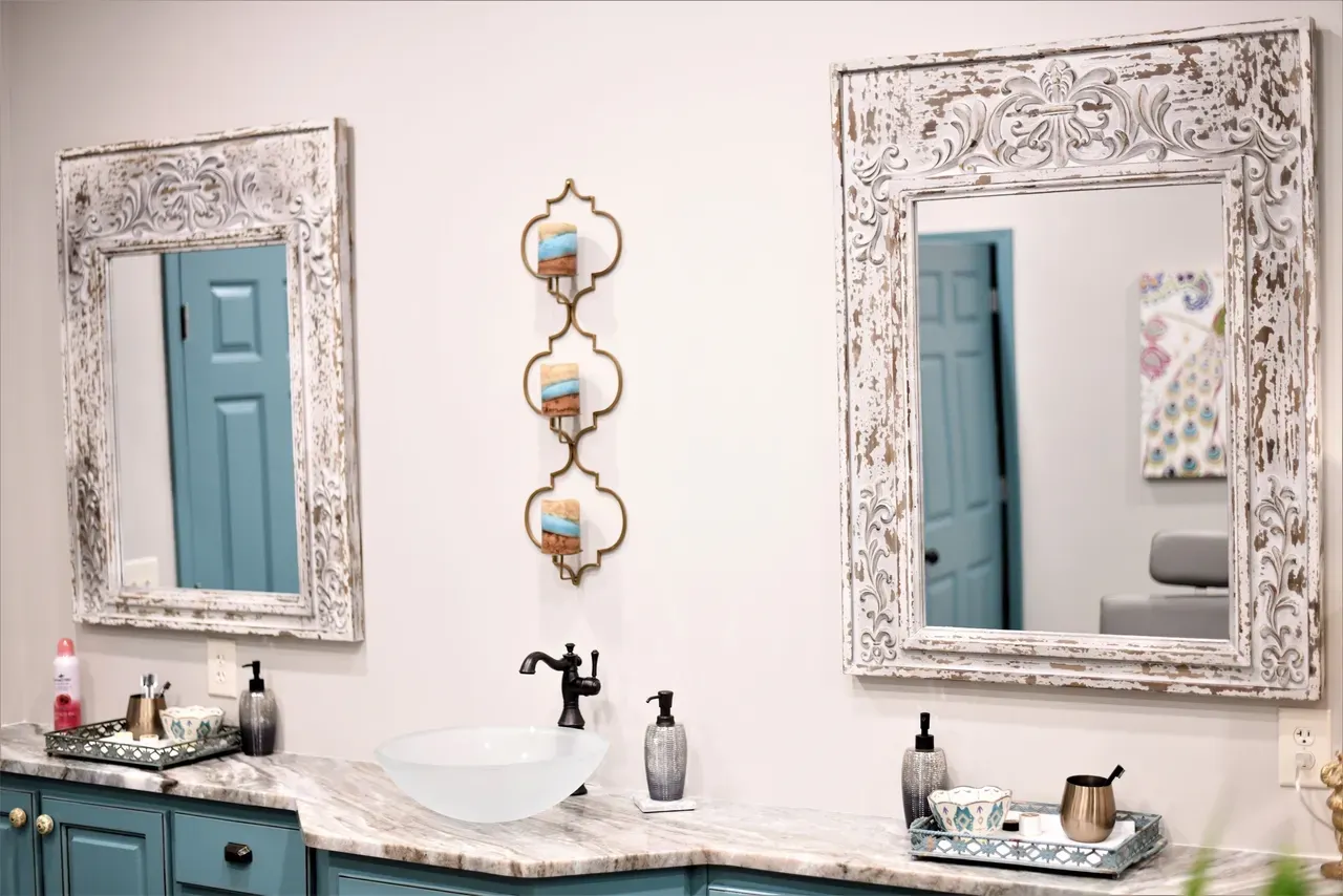 Double vanity with ornate mirrors