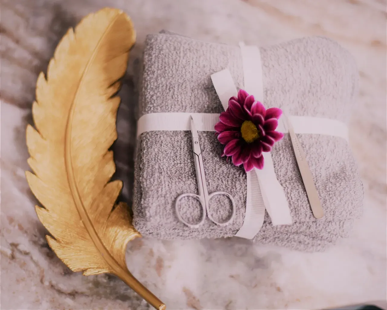 Towel with flower and manicure tools