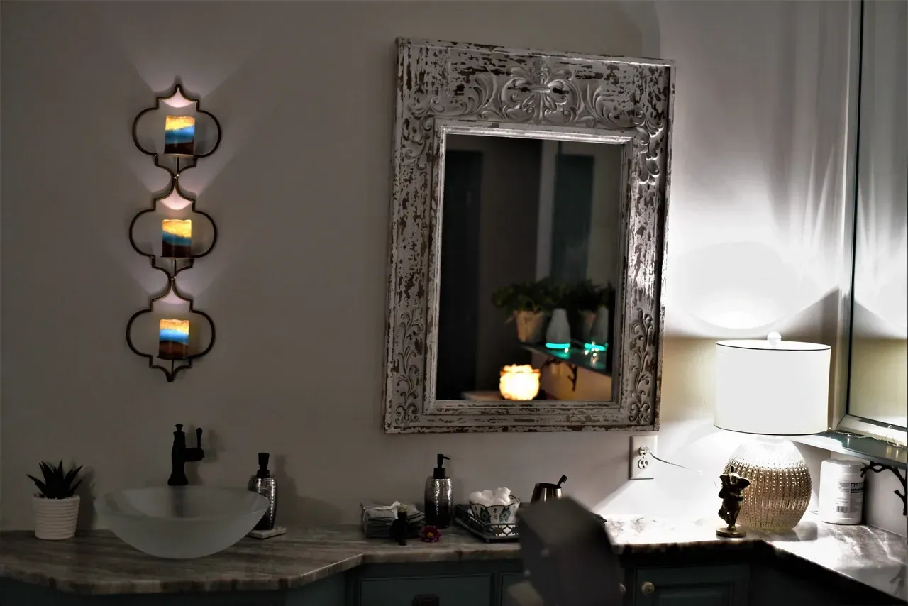 Cozy bathroom with modern lamps and candles