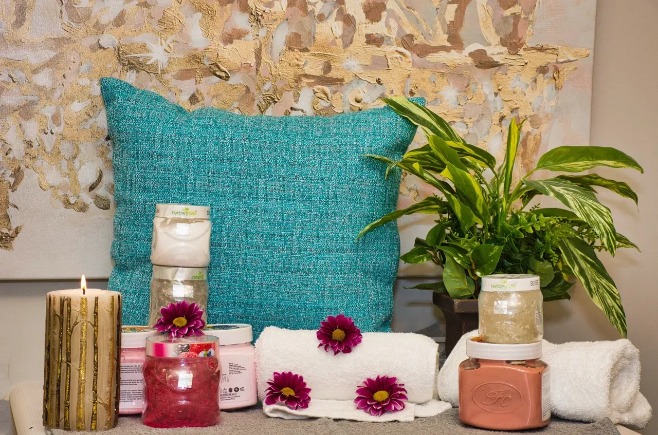 Spa essentials with candles and towels